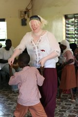 Laura McCauley dancing with Modou during her placement at GOVI in the Gambia