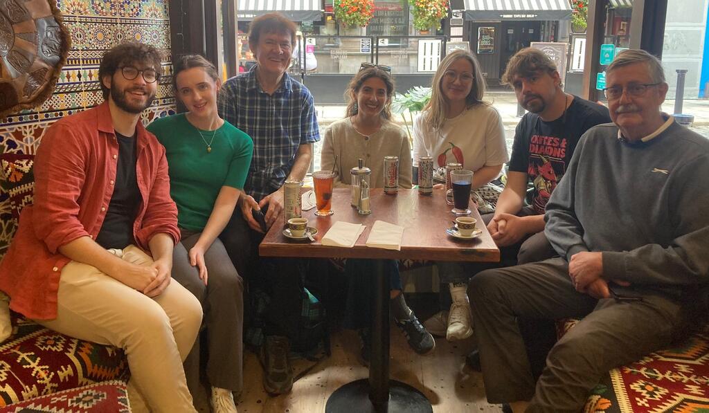 Walking tour group sitting down together